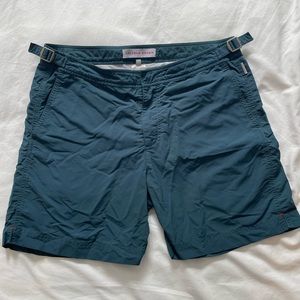 Classic ORLEBAR brown in a dark hunter green. Bulldog style (mid thigh length)